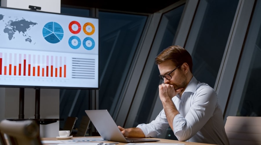 Person working on computer with access to a management portal