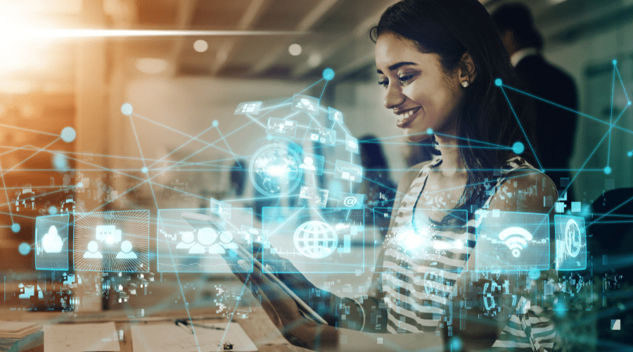 Woman surrounded by holograms representing cloud technology connectivity and data flow